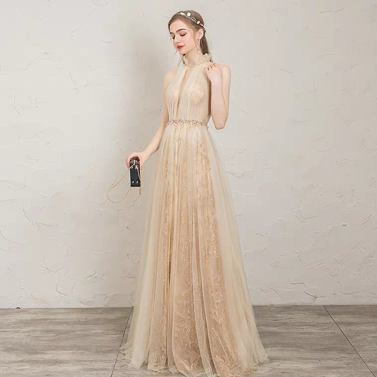 The Penelopia Champagne Halter Gown